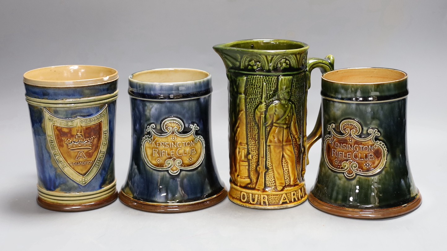 Three Royal Doulton stoneware rifle club commemorative mugs, early 20th century for Kensington rifle club and Surrey Yeomanry miniature rifle club together with an Our Army and Navy jug, tallest 16.5cm (4), Naval jug 16